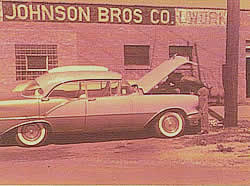 2nd Building in Bellwood, IL, owned by Johnson Bros. Sign painted by Ed Johnson, Jr. Arnie Johnson and his Olds.